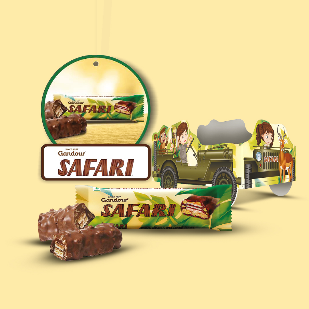 Two Gandour Safari chocolate bars with packaging, a hanging tag, and a cardboard jeep cutout. Design by Greysell.